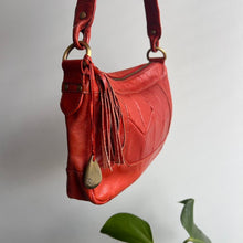 Load image into Gallery viewer, Orange leather bag with tassel detail
